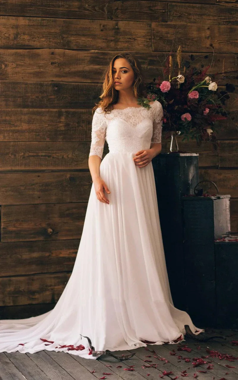 Vestido largo de gasa con mangas 3/4 y escote de encaje en forma de A